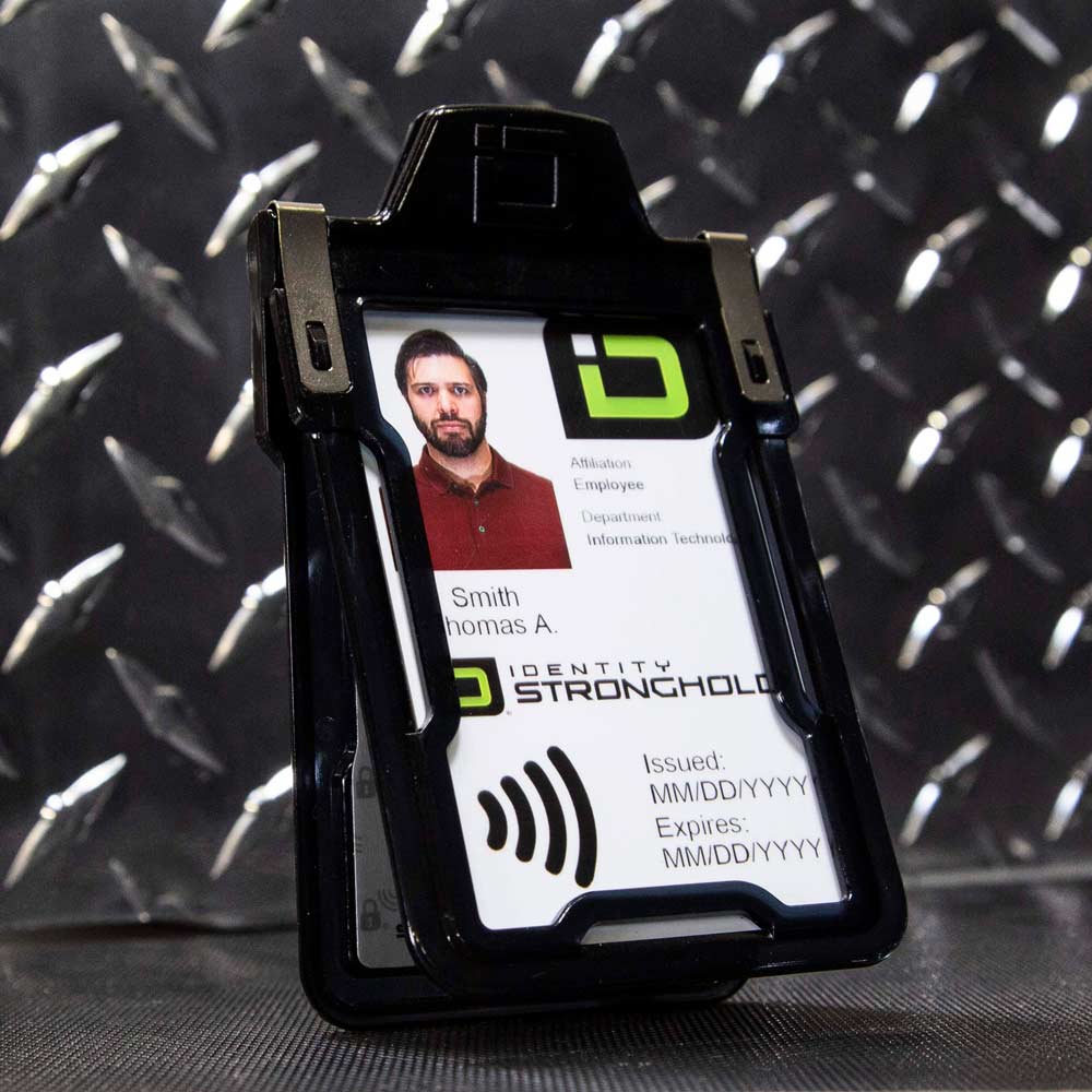 Black RFID-blocking badge holder securely displaying an employee ID card .