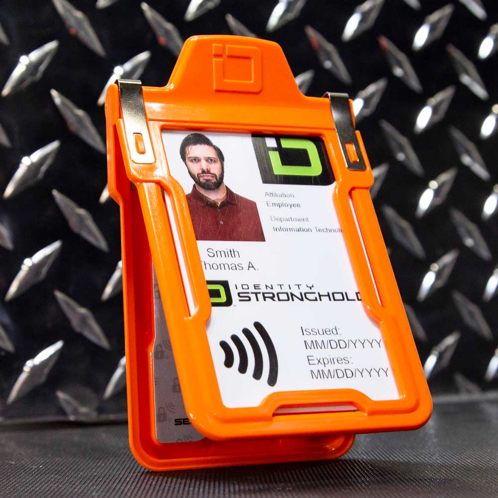 Orange RFID-blocking badge holder securely displaying an employee ID card – Durable and secure identity protection from ID Stronghold.