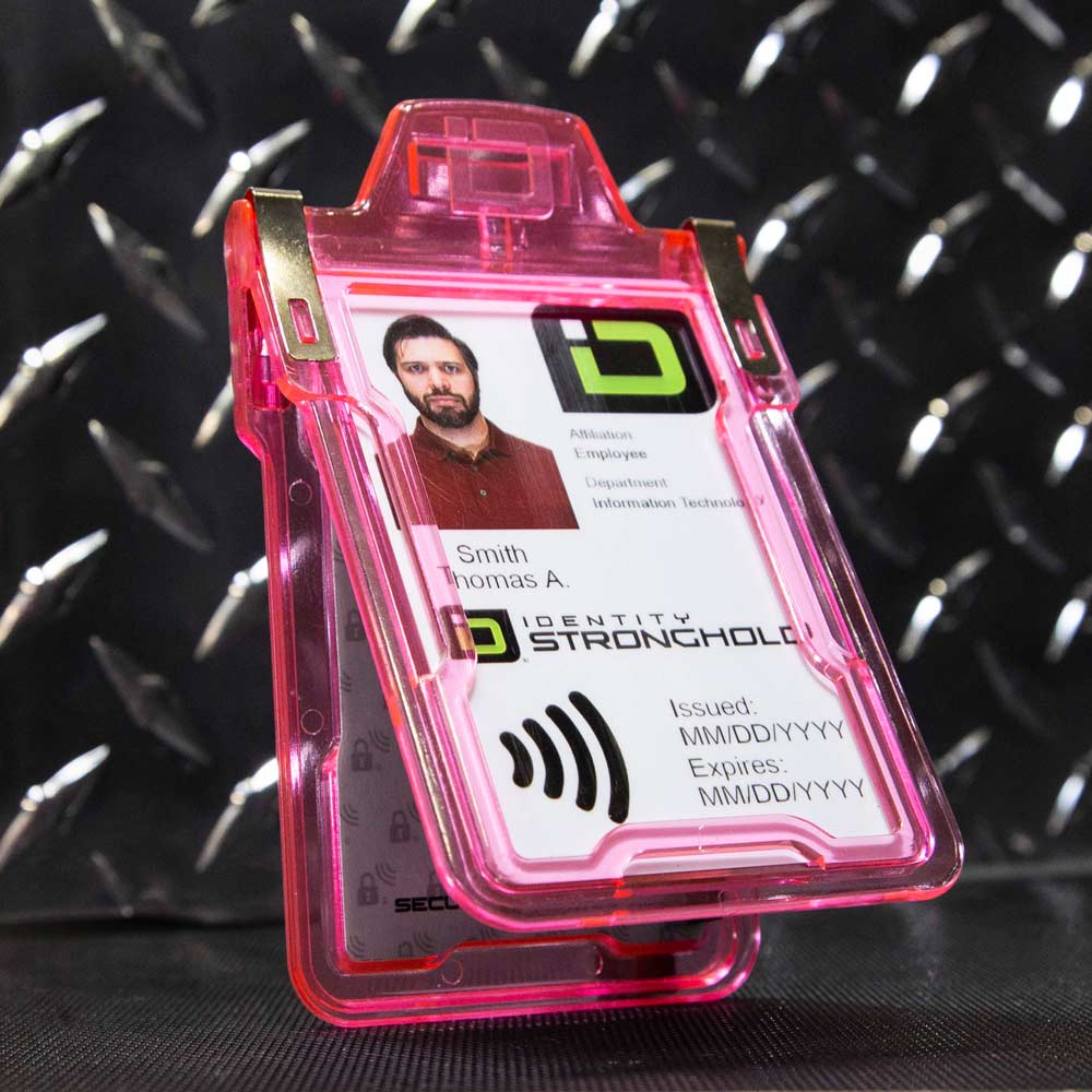 Pink RFID-blocking badge holder securely displaying an employee ID card .